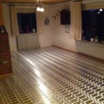 Etablering af elektrisk gulvvarme i en stue.